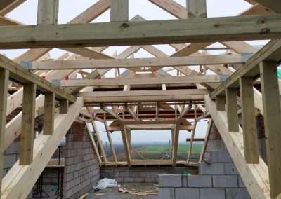 image shows the interior view of roof trusses supplied and installed by enviro timber engineering in downham market